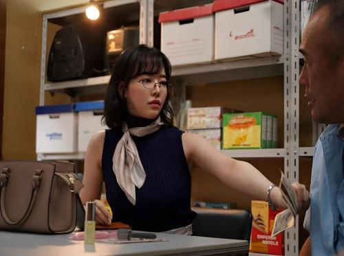 The beautiful manager paid the worker